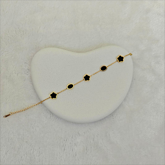 Gold Stainless Steel Chain Bracelet with Alternating Black Enamel Motifs